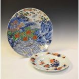 Japanese charger with landscape decoration and an Imari plate