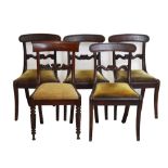 Set of four early 19th Century sabre-leg mahogany dining chairs, and other