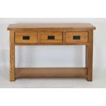 Modern light oak three drawer console table