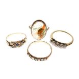 Four gold dress rings