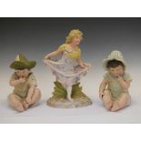 Pair of 'Piano Babies' and bisque figure