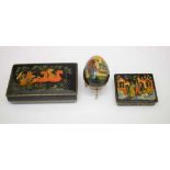 Two Russian lacquer boxes, and an egg