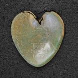 Group of archaeological finds including heart-shaped casket