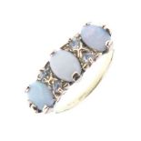 Three-stone opal ring, stamped '18ct'