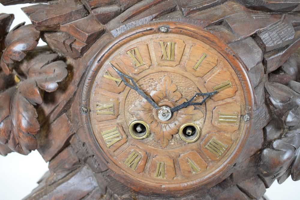 Impressive Black Forest carved linden wood table clock - Image 7 of 11