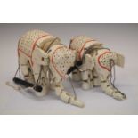 Two vintage wooden painted elephant puppets