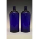 Two large blue glass bottles, etc.