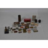 Shell case vase and group of lighters/tins