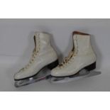 White leather ice skating boots