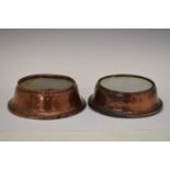 Two old copper dog bowls