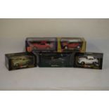 Five boxed 1/18 scale diecast model vehicles