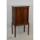 Edwardian veneered cabinet on later stand
