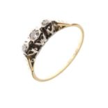 Yellow metal (18ct and Plat) ring set three diamonds