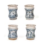 Group of four white and blue majolica albarelli