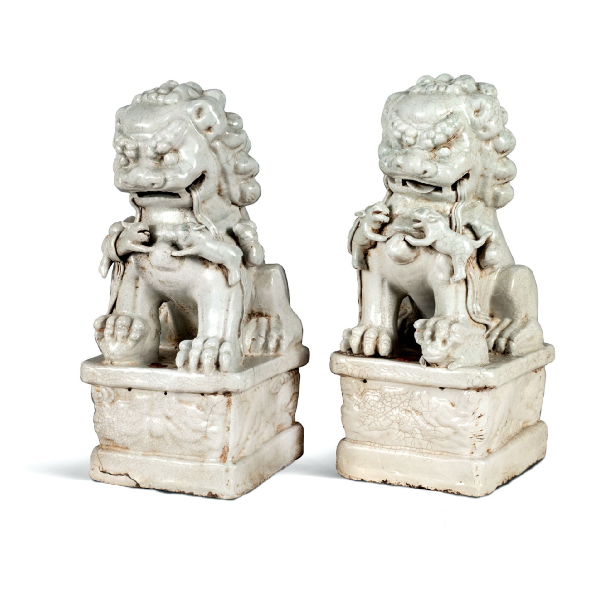 Pair of white glazed terracotta figures