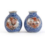 Pair of small polychrome porcelain vases