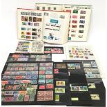 Strand stamp album with additional loose sheets of common wealth stamps