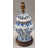 Oriental blue and white table lamp with blue shade.