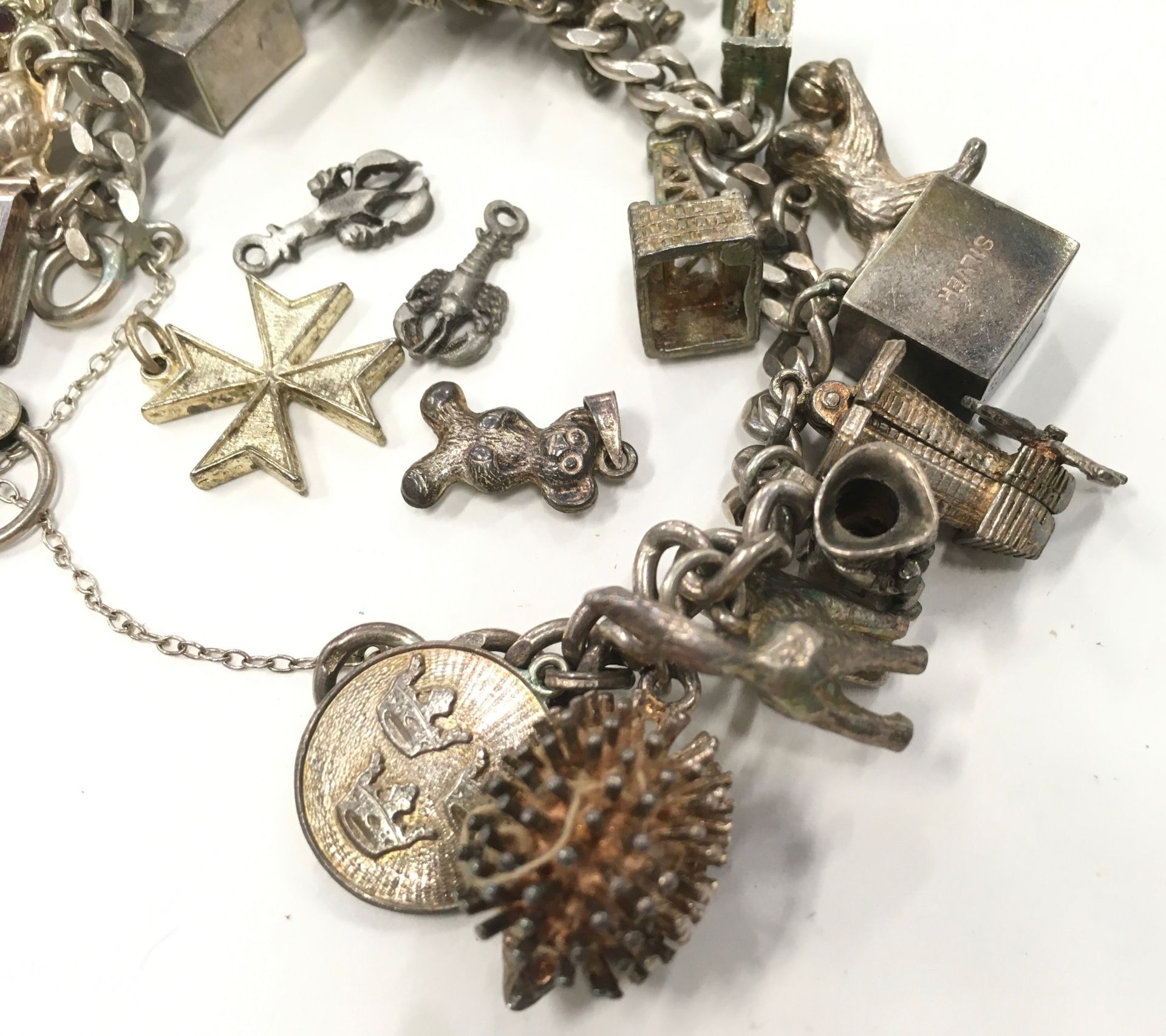 Silver charm bracelet with a large collection of charms. - Image 3 of 4