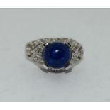 9ct white gold ladies diamond side, unpolished sapphire center stone ring size O