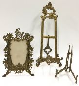 Rococo brass easel picture frame together with a Rococo style plated stand.