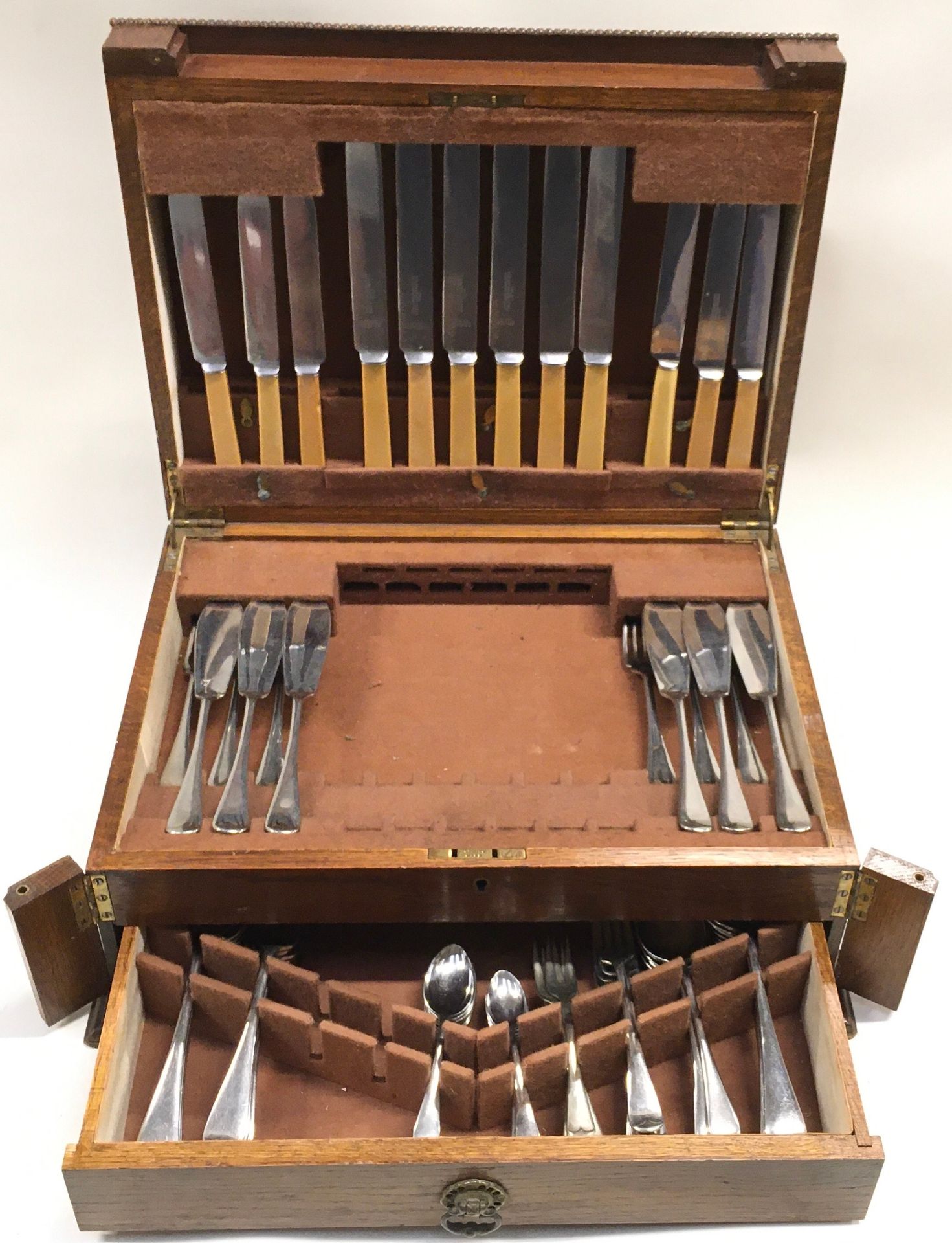 Extensive canteen of cutlery by William Bocking. Hinged box with drawer under.