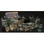 Large quantity of various vintage glass bottles and jars to include medicine bottles.