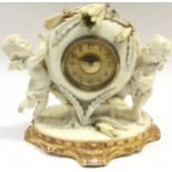 Vintage porcelain mantle clock centrepiece by Moore pottery featuring winged cherubs. Some slight