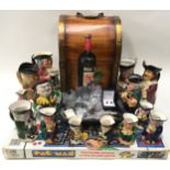 Collectible items to include wooden wine box to hold 4 bottles, a quantity of character jugs,