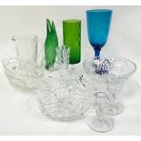 A collection of coloured and crystal glassware.