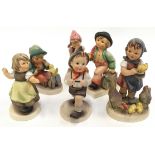 A collection of six Hummel/Goebel figures.