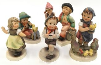 A collection of six Hummel/Goebel figures.