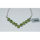 Silver gem set green stone necklace.