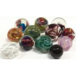Collection of glass paperweights to include examples by Langham and Caithness