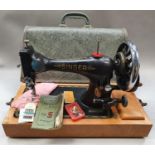 Vintage Singer sewing machine in case.