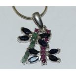 Sapphire, Ruby and Emerald dragonfly pendant on silver chain.