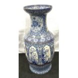 A 19th century very large blue and white porcelain vase with antique staple repairs in need of