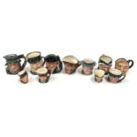 Eleven toby character jugs with examples by Royal Doulton and Beswick.