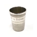 Silver H/M spirit measure in the style of a sewing thimble 4cm tall.