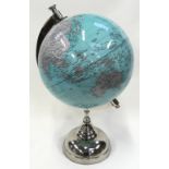 A modern revolving globe of the world on polished chrome stand 52cm tall.