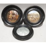 A pair of Victorian ceramic pot lids in oak frames together with another fabric pot lid.