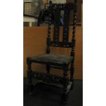 Vintage high back ebonised hall chair with barley twist and carved decoration.
