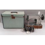 Vintage Jones Consort electric sewing machine with foot pedal in case.