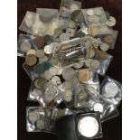 Vintage tin and glass piggy bank of mixed assorted coinage to include silver examples.