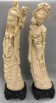 Pair oriental figures in the form of tusks stood on hard wood bases 60cm tall