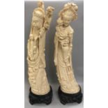 Pair oriental figures in the form of tusks stood on hard wood bases 60cm tall