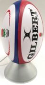 Table lamp in the form of a Gilbert England Rugby ball