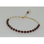 18ct gold on silver garnet and cultured pearl bracelet.