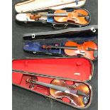 2 cased violins along with a vintage cased viola. 2 with bows. One violin has a label inside case