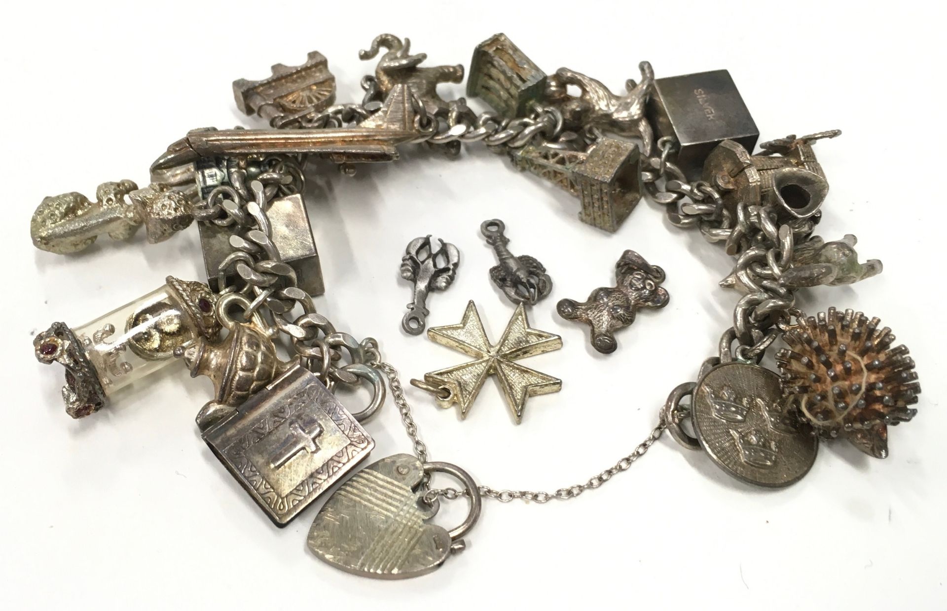 Silver charm bracelet with a large collection of charms. - Image 4 of 4